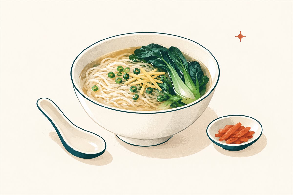 Bowl of clear Cantonese noodle soup with leafy greens, scallion, and ginger